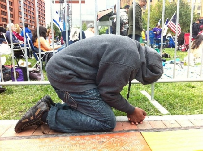 man kneeling prayer